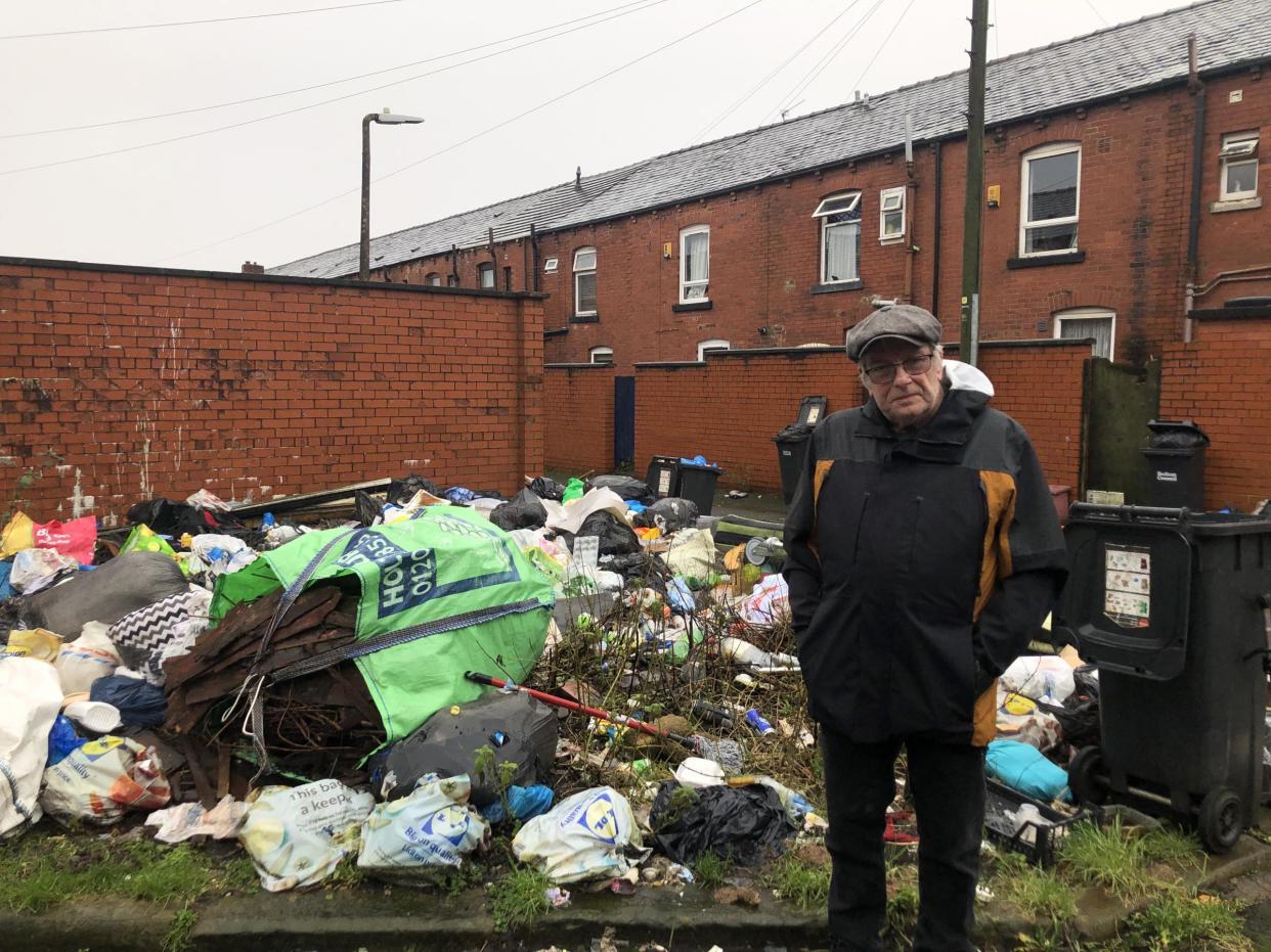 Resident and Green Party candidate for Rumworth, Alan Johnson beside the rubbish. (SWNS)