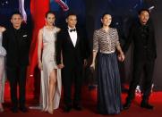 Cast members of "The Grandmaster" Tony Leung (L), Zhang Jin (3rd L), Zhang Ziyi (2nd R) and Chang Chen (R) walk with Zhang Jin's wife Ada Choi on the red carpet during the 33rd Hong Kong Film Awards in Hong Kong April 13, 2014. REUTERS/Tyrone Siu (CHINA - Tags: ENTERTAINMENT)