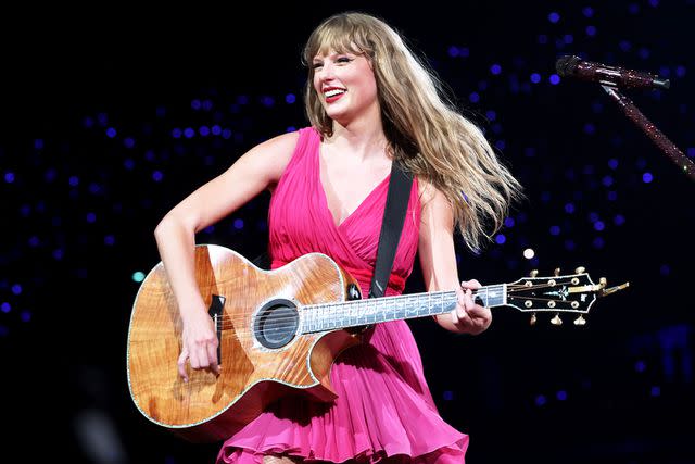 <p>Kevin Mazur/Getty</p> Taylor Swift wearing a pink dress at the Eras Tour