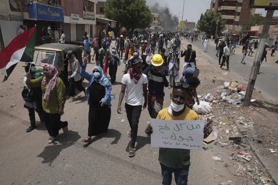 Sudanese anti-military protesters march in demonstrations in the capital of Sudan, Khartoum on June 30, 2022. The Sudanese sign reads: "They are coming towards you from everywhere. Million-man march, 30 June.” A Sudanese medical group says multiple people were killed on Thursday in the anti-coup rallies during which security forces fired on protesters denouncing the country’s military rulers and demanding an immediate transfer of power to civilians. (AP Photo/Marwan Ali)