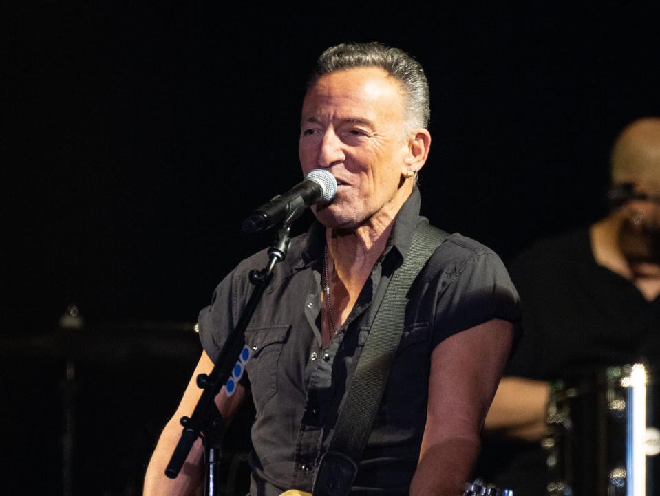 Bruce Springsteen performing on stage