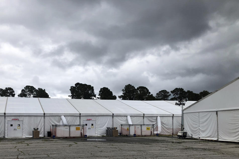 FILE - In this May 27, 2020 file photo, quarantine tents set up for recruits arriving at the Marine Corps' Parris Island Recruit Depot, S.C. The tents were used until earlier in the week and now recruits go through quarantine at the Citadel, the Marine college in Charleston, S.C. A study published on Wednesday, Nov. 11, 2020 found that despite temperature and COVID-19 symptom checks and strict quarantines before they were allowed to start training, new Marine recruits spread the virus to others even though hardly any of them had symptoms. None of the infections that occurred were caught through symptom screening. (AP Photo/Lolita Baldor)