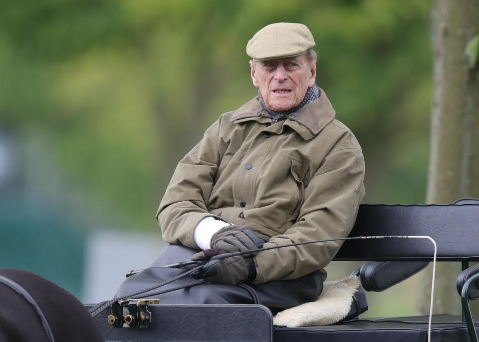 The Duke of Edinburgh drives a carriage during the Royal Windsor Horse Show in Windsor, Berkshire.