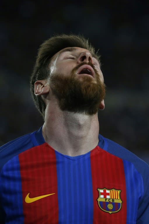 Barcelona's Lionel Messi grimaces during their UEFA Champions League quarter-final second leg football match against Juventus at the Camp Nou stadium in Barcelona on April 19, 2017