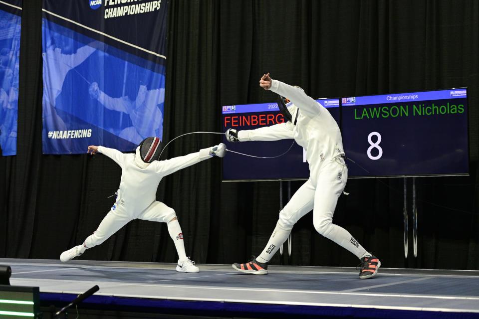 Ohio State fencer Gabriel Feinberg, of Lincoln, defeats Nicholas Lawson to win the NCAA men's epee championship on March 27, 2022.