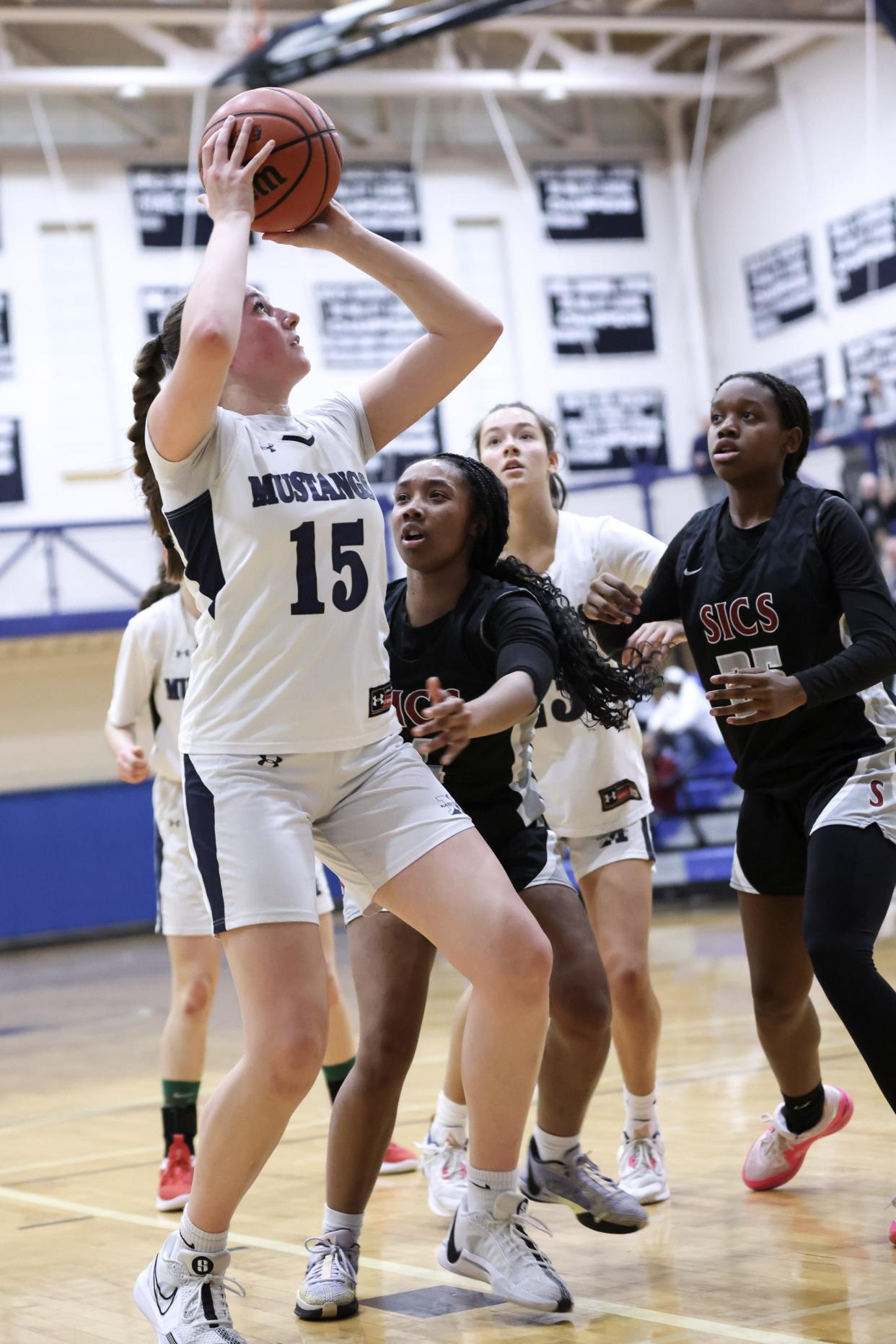 Medway sophomore Anna Freeman shoots for two points during the Division 3 Sweet 16 playoff game against Springfield International Charter School at Medway High School on Mar. 05, 2024.