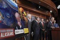 Sen. Dan Sullivan, R-Alaska, center, with several of his Senate colleagues discuss during a news conference how the Biden administration's upcoming sanctions on America's ability to produce oil and critical minerals weaken America's energy security and embolden enemies on Capitol Hill Thursday, April 18, 2024, in Washington. (AP Photo/Mariam Zuhaib)