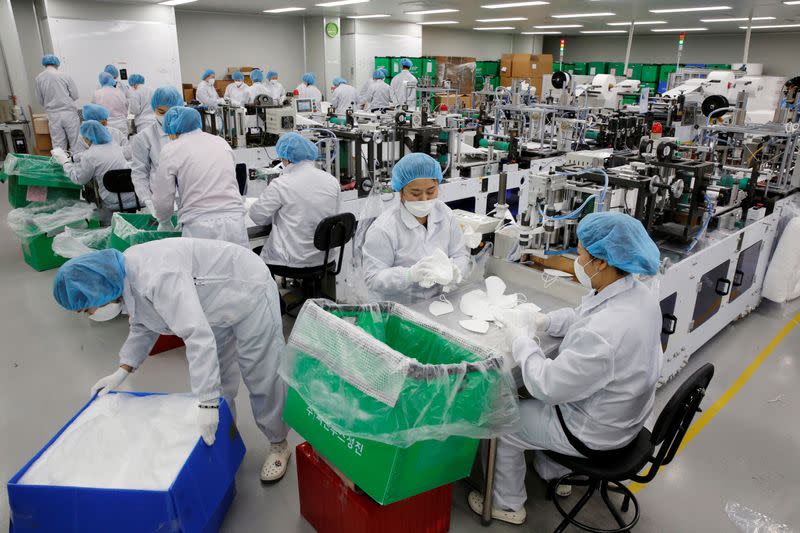 Employees work at a mask factory in Icheon