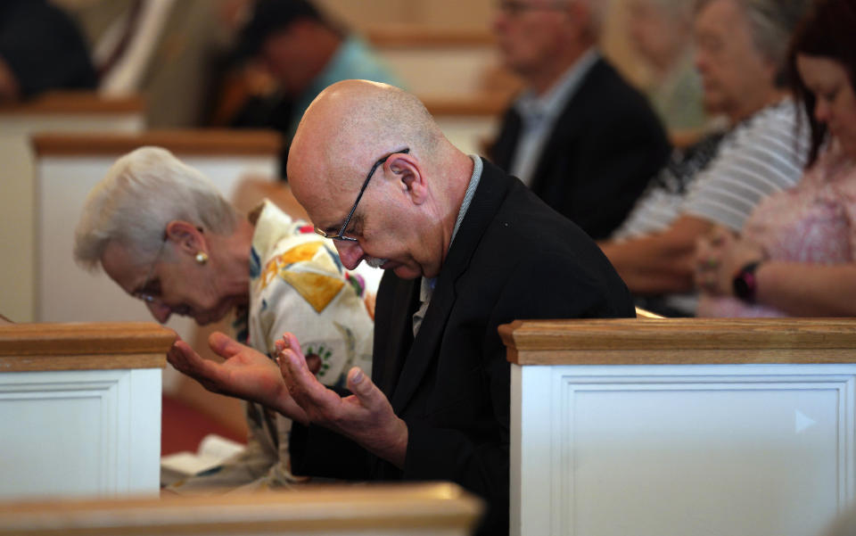 Members of Fern Creek Baptist Church pray during a service, Sunday, May 21, 2023, in Louisville, Ky. (AP Photo/Jessie Wardarski)