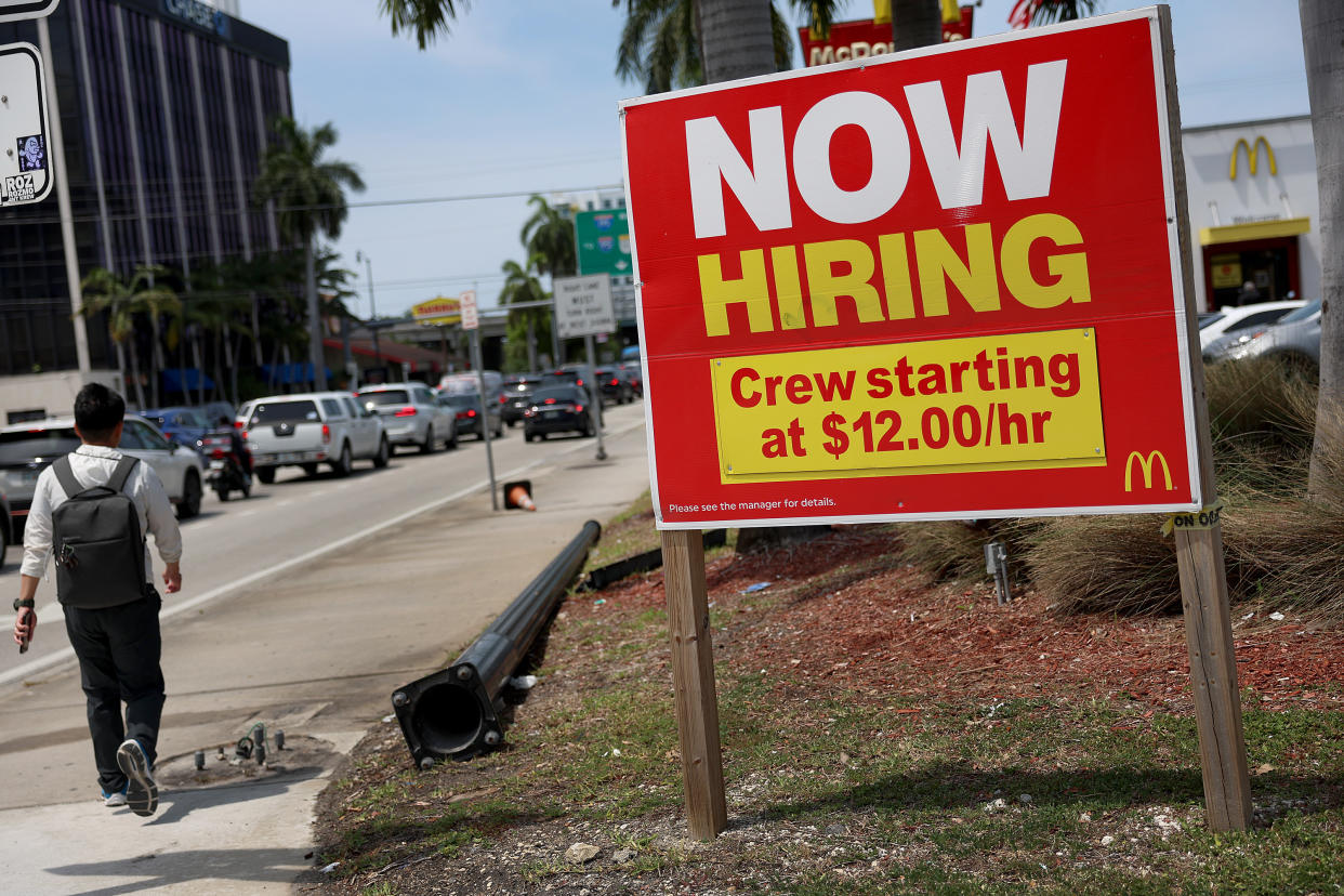 FTSE MIAMI, FLORIDA - MAY 05: A 'Now Hiring' sign posted outside of a restaurant looking to hire workers on May 05, 2023 in Miami, Florida. A report by the Bureau of Labor Statistics showed the US economy added 253,000 jobs in April.  (Photo by Joe Raedle/Getty Images)