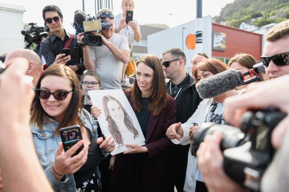 Prime minister Jacinda Ardern considers what her most suitable facial expression should be after receiving the gift of a portrait from a wellwisher in Lyttelton on Tuesday.