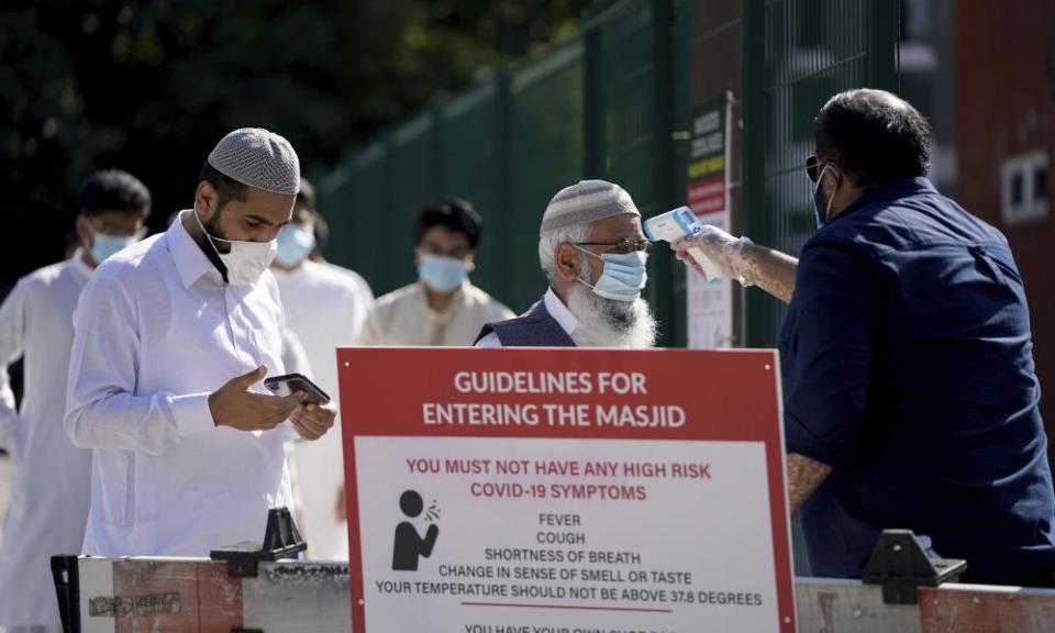 Muslim men having a temperature check at Manchester Central Mosque