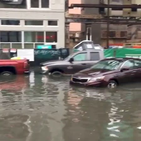 Submerged vehicles are seen in a flooded area of New Orleans, Louisiana