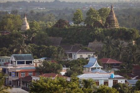 Landscape view of downtown with ancient pagodas in the background in Mrauk U