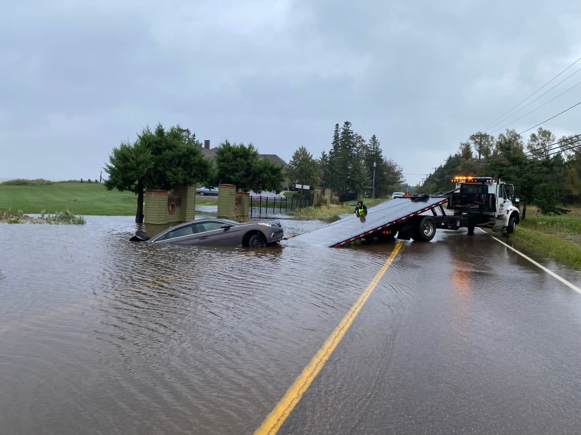 A car inundated with water near Shediac as a result of flooding caused by post-tropical storm Fiona. (Aniekan Etuhube/CBC - image credit)