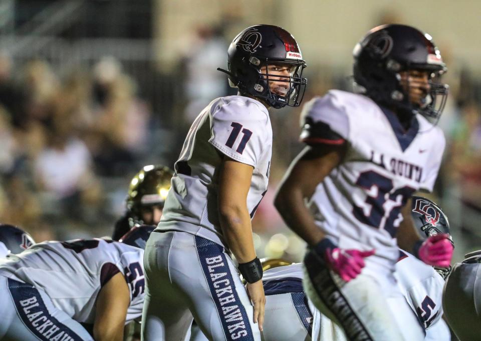 The La Quinta offense, shown here setting up a play versus Xavier Prep on Oct. 14, 2022, ran for 584 yards versus Granite Hills last week and has averaged 43.4 points over the Blackhawks' last seven games.