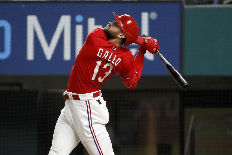 Texas Rangers Joey Gallo watches a fly ball during the ninth inning of a baseball game against the Baltimore Orioles in Arlington, Texas, Friday, April 16, 2021. Texas lost the game 5-2. (AP Photo/Roger Steinman)