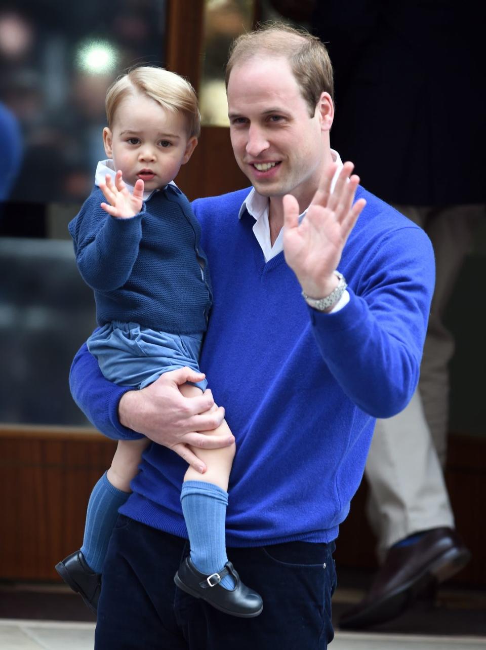 <p>George and William wave to the press at the Lindo Wing at St. Mary's Hospital shortly after the birth of Princess Charlotte in May 2015. George is currently third-in-line to the throne, after dad William (second) and grandpa Charles (first).</p>