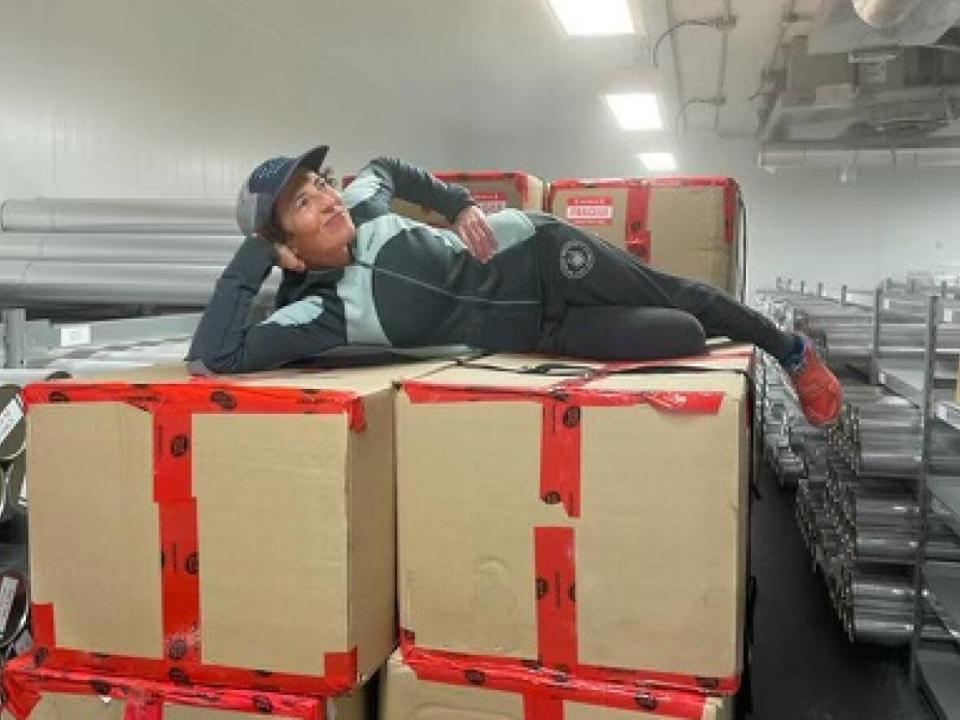 Alison Criscitiello shows off the boxes of ice core samples collected from Mount Logan, Yukon. She believes the ice cores could be 30,000 years old. (Anne Myers - image credit)