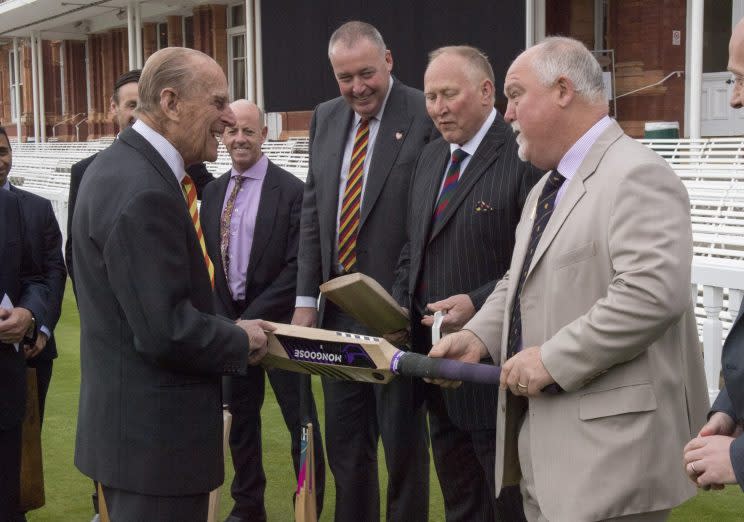 The Duke of Edinburgh (left) is shown a number of bats by Mike Gatting (right), during a visit to Lord's cricket ground