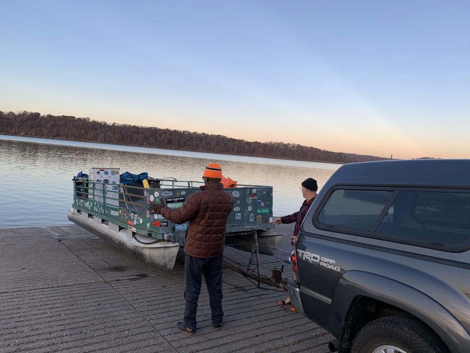 Herb Caldwell and Jon Barnitt launch their 50-year-old boat Idlene into Lake Monroe on a cool November morning.