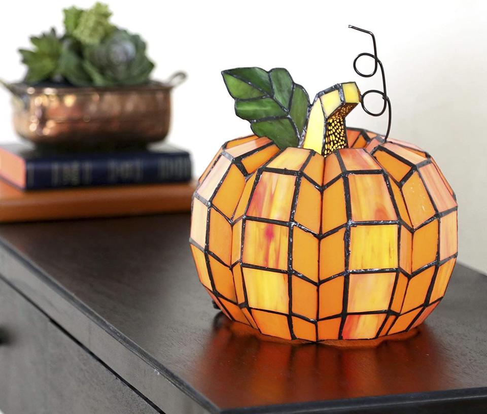 <p><strong>RIVER OF GOODS</strong></p><p>amazon.com</p><p><strong>$89.23</strong></p><p>Cleverly named Patch, this stained glass pumpkin might just be the most gorgeous piece of fall décor we've seen. </p>