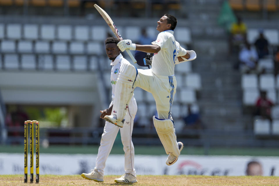 India's Yashasvi Jaiswal celebrates after he scored a century against West Indies on day two of their first cricket Test match at Windsor Park in Roseau, Dominica, Thursday, July 13, 2023. (AP Photo/Ricardo Mazalan)