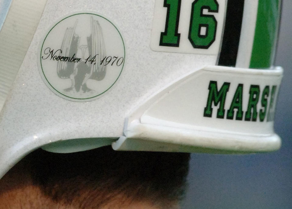 A decal honoring the Memorial Fountain at Marshall University's student center adorns quarterback Jimmy Skinner's helmet Saturday, Nov. 19, 2005, in Huntington, W.Va. This year is the 35th anniversary of the crash of a chartered plane that took the lives of 75 players, coaches, staff members, community supporters and the flight crew returning from Marshall's game at East Carolina. Players are wearing the decals in memory of the lives lost. (AP Photo/Jeff Gentner)