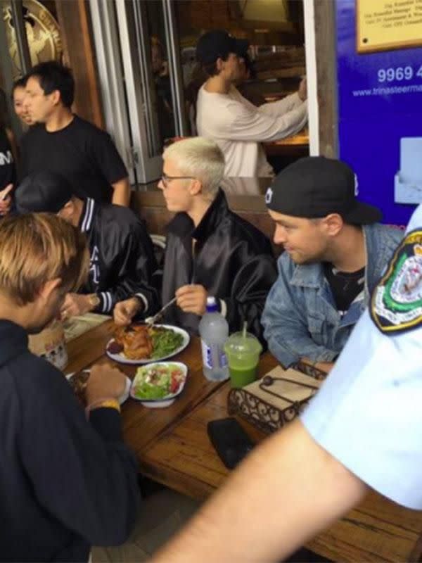 Justin sampling Chargrill Charlie's famous chicken. Photo: Sweaty Betty PR
