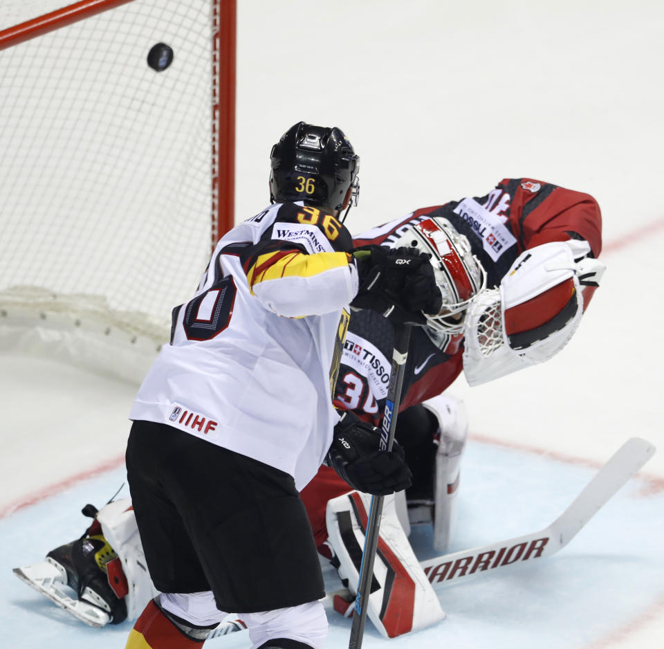 Germany's Yannic Seidenberg, left, watches as Canada's goaltender Matt Murray, right, fails to make a save during the Ice Hockey World Championships group A match between Canada and Germany at the Steel Arena in Kosice, Slovakia, Saturday, May 18, 2019. (AP Photo/Petr David Josek)