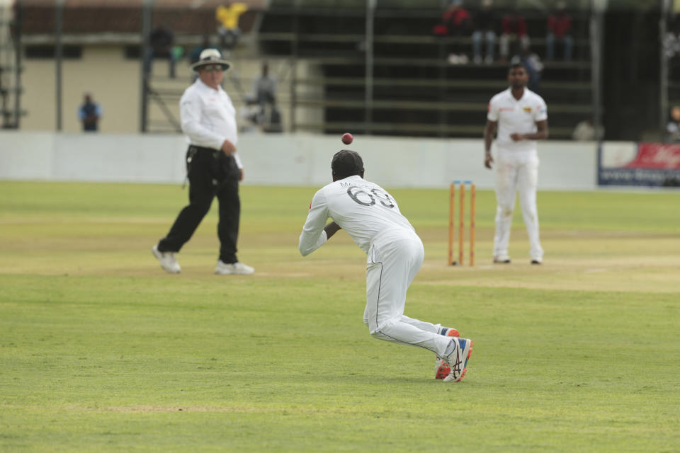 Sri Lanka bowler Angelo Mathews takes a catch during the test cricket match against Zimbabwe at Harare Sports Club, Monday, Jan. 20, 2020.Zimbabwe is playing in its first international match since the International Cricket Council lifted the country's ban last year(AP Photo/Tsvangirayi Mukwazhi)