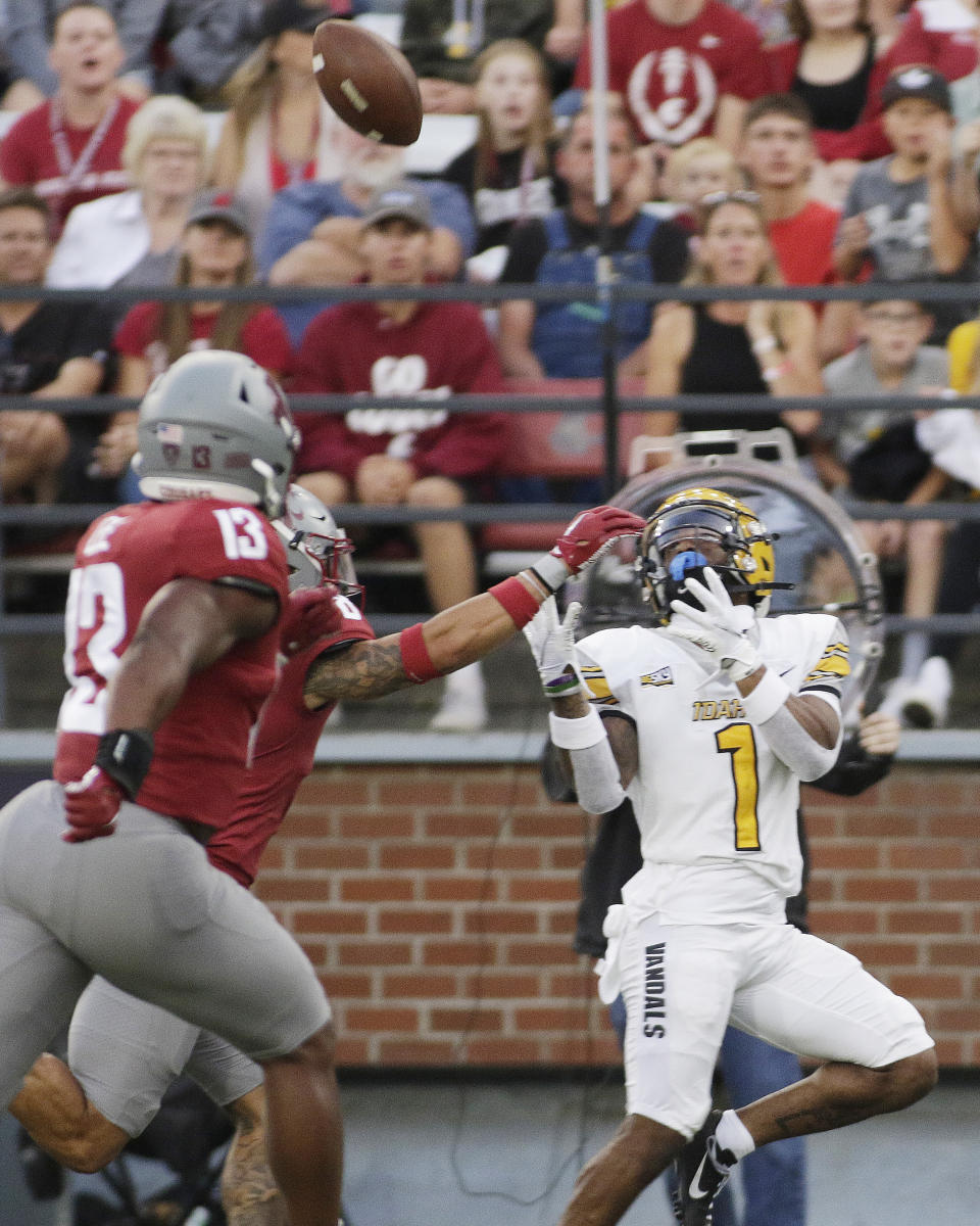 Idaho wide receiver Jermaine Jackson, right, reaches out for a pass, which he caught, while defended by Washington State defensive back Armani Marsh, back left, during the first half of an NCAA college football game Saturday, Sept. 3, 2022, in Pullman, Wash. (AP Photo/Young Kwak)