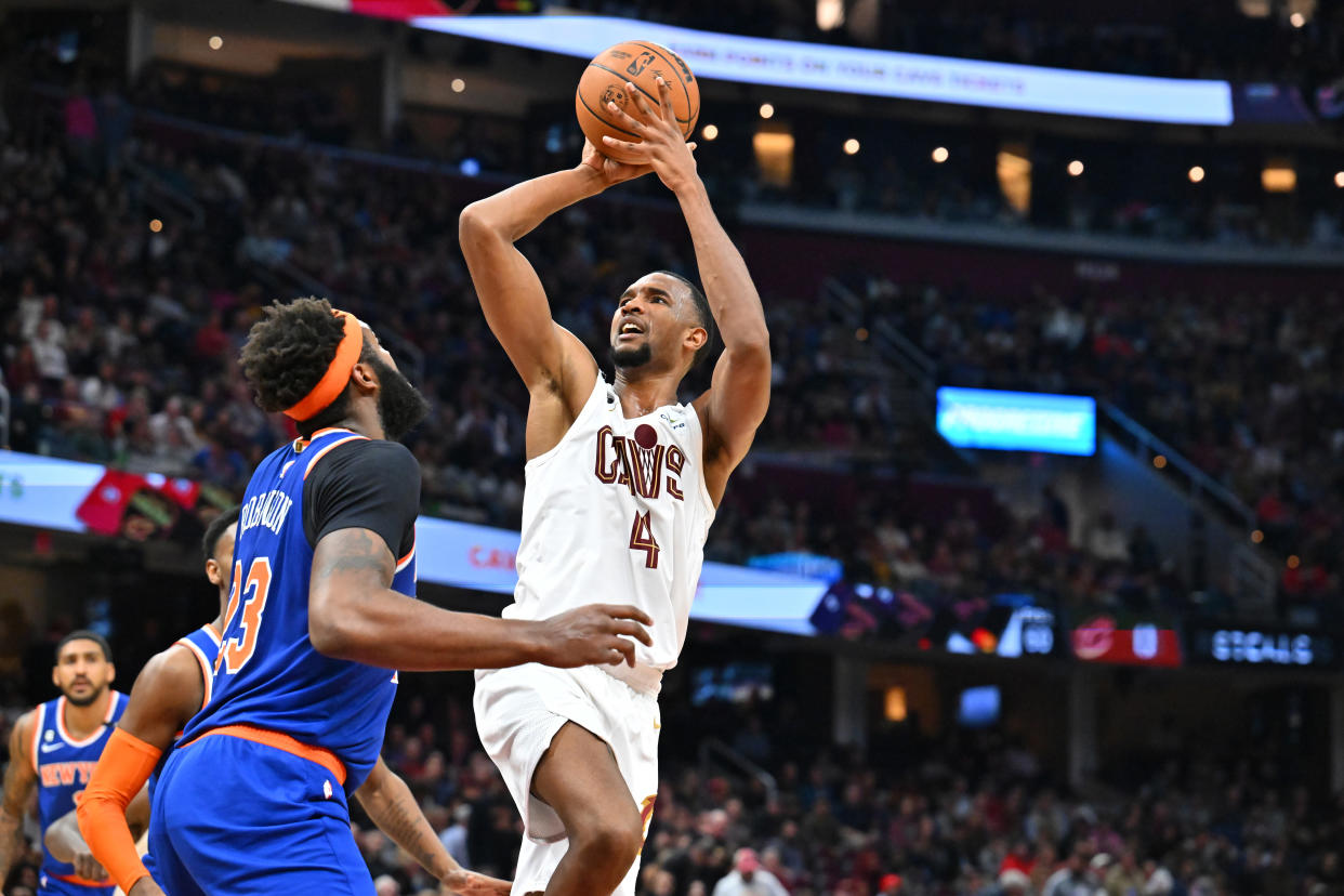 Cleveland Cavaliers forward Evan Mobley shoots over New York Knicks center Mitchell Robinson during a regular season game at Rocket Mortgage Fieldhouse in Cleveland on March 31, 2023. (Jason Miller/Getty Images)