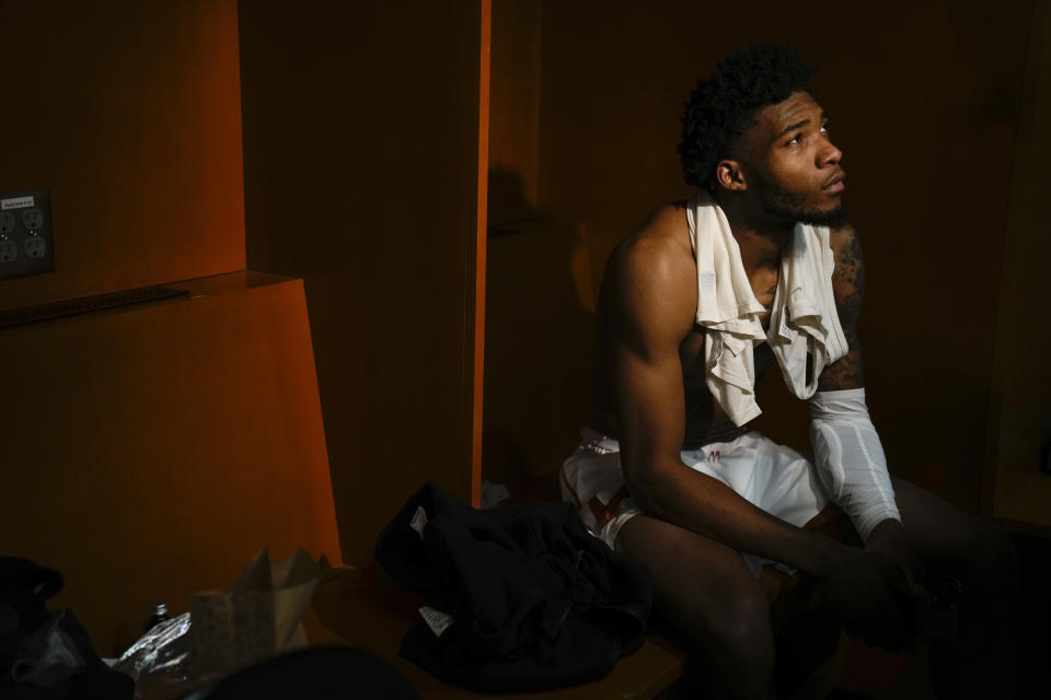 Texas guard Tyrese Hunter sits in the locker room after their loss against Miami in an Elite 8 college basketball game in the Midwest Regional of the NCAA Tournament Sunday, March 26, 2023, in Kansas City, Mo. (AP Photo/Jeff Roberson)