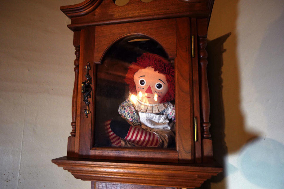 real Annabelle doll in a wooden and glass case