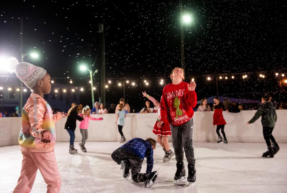 Kids skate during the Christmas Tree lighting ceremony in Prattville, Ala., on Thursday, Dec. 2, 2021.