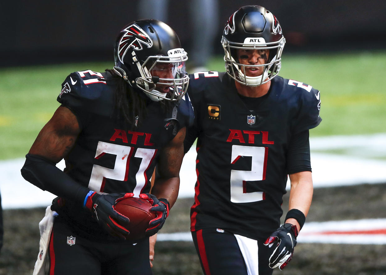 ATLANTA, GA - SEPTEMBER 27: Matt Ryan #2 reacts with Todd Gurley II #21 of the Atlanta Falcons after Gurley's touchdown during the second half of an NFL game against the Chicago Bears at Mercedes-Benz Stadium on September 27, 2020 in Atlanta, Georgia. (Photo by Todd Kirkland/Getty Images)