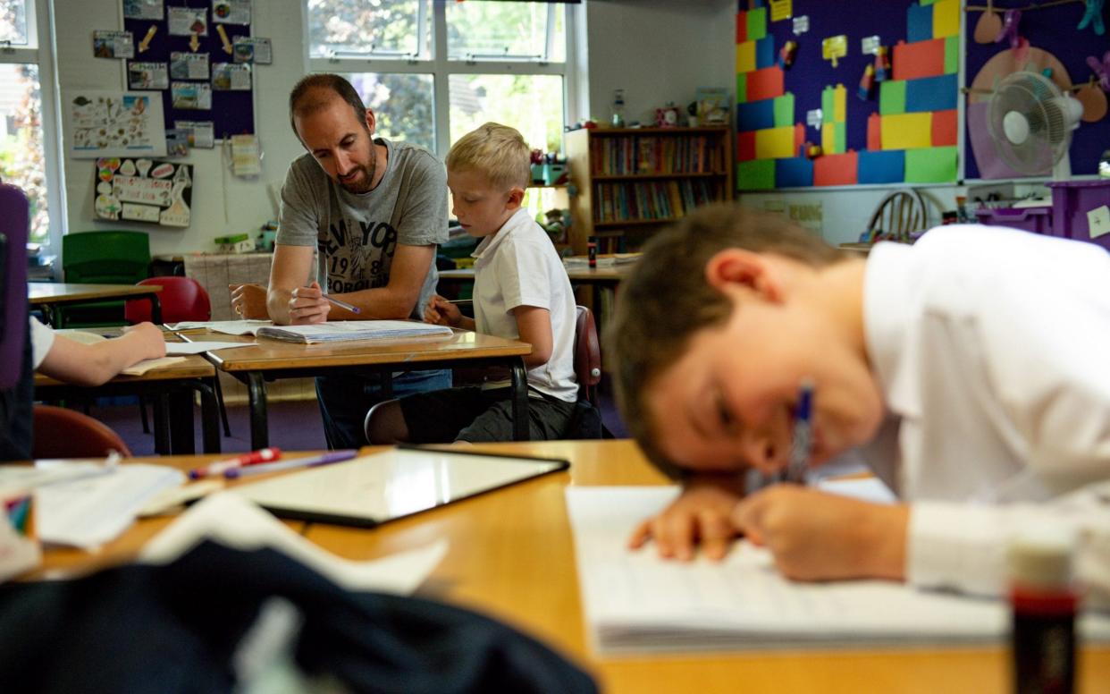 Children of essential workers socially distance whilst in lesson at Kempsey Primary School in Worcester - PA