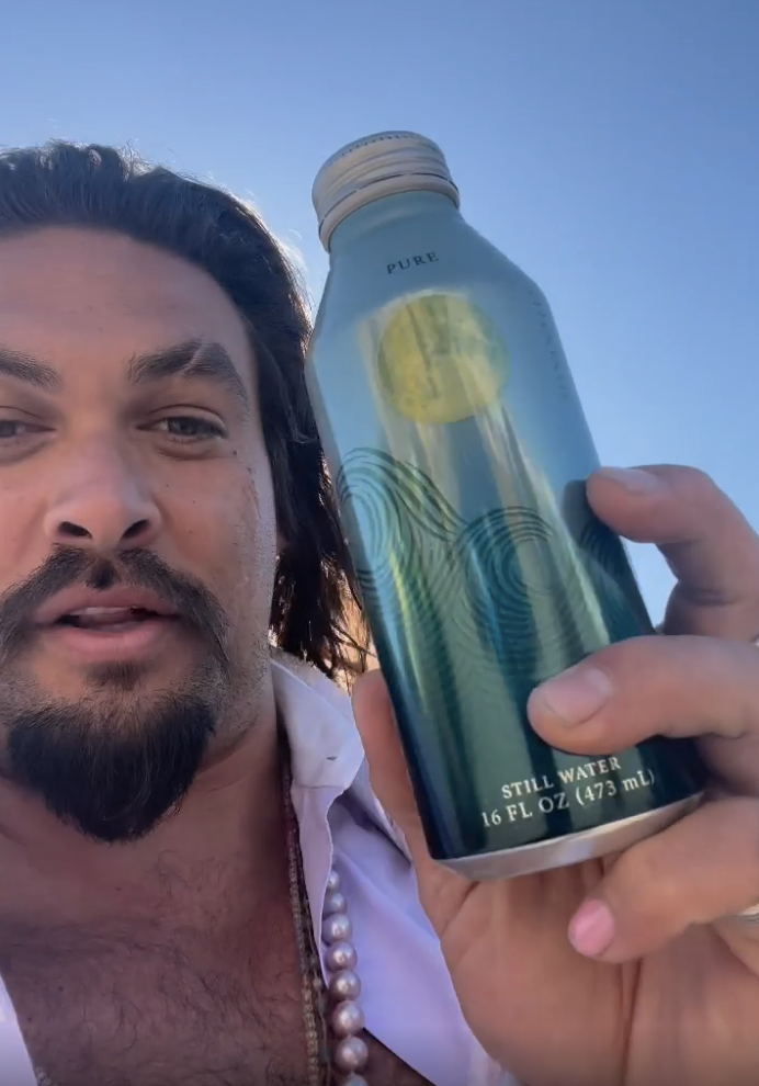 Jason Momoa with an aluminum water bottle