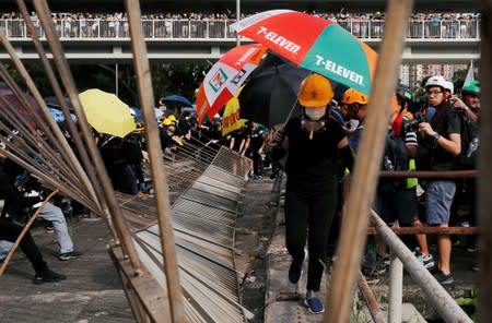 Demonstrators march to protest against the Yuen Long attacks in Yuen Long