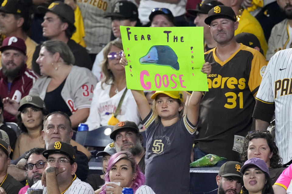 A San Diego Padres fans hold a fear the goose sign during the fourth inning in Game 1 of the baseball NL Championship Series between the San Diego Padres and the Philadelphia Phillies on Tuesday, Oct. 18, 2022, in San Diego. (AP Photo/Ashley Landis)