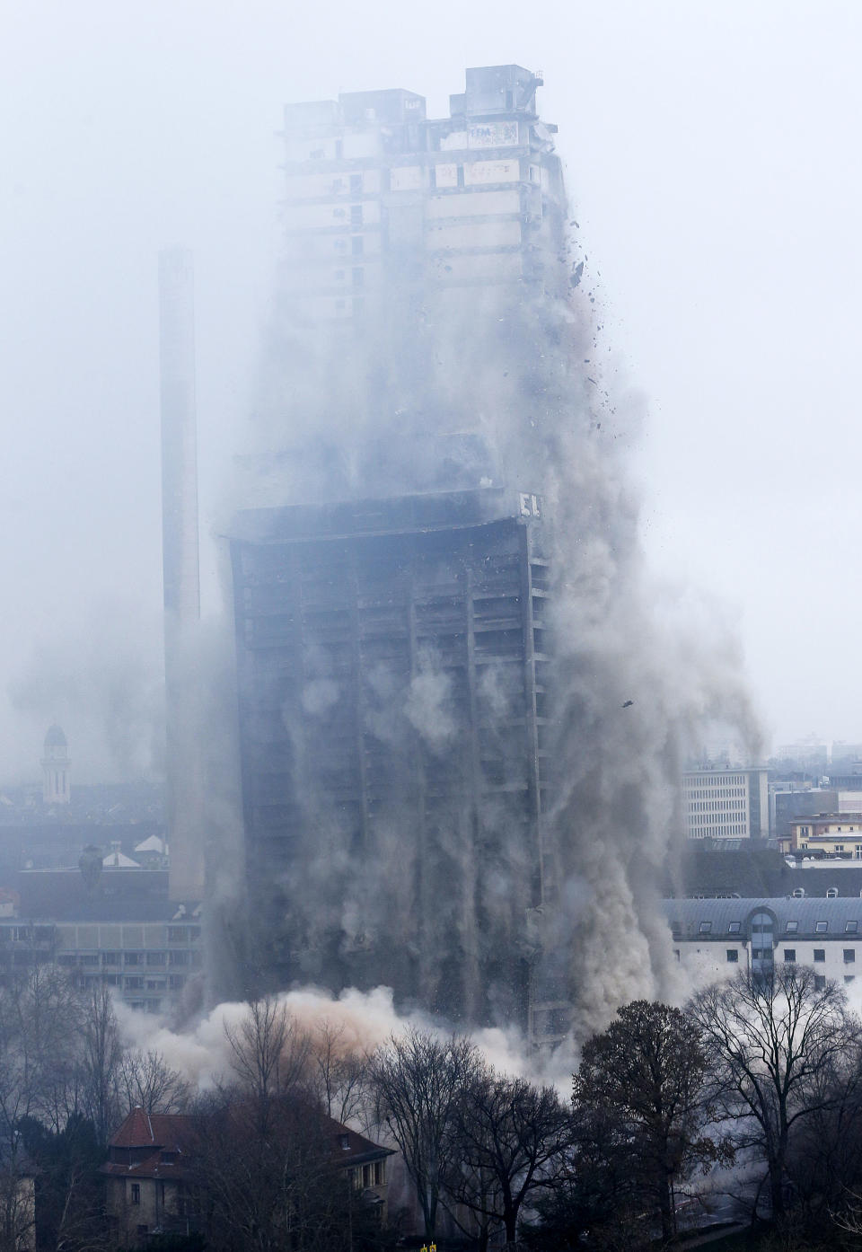 A former university tower is blown up followed by thousands of spectators in Frankfurt, Germany, Sunday, Feb. 2, 2014. (AP Photo/Michael Probst)