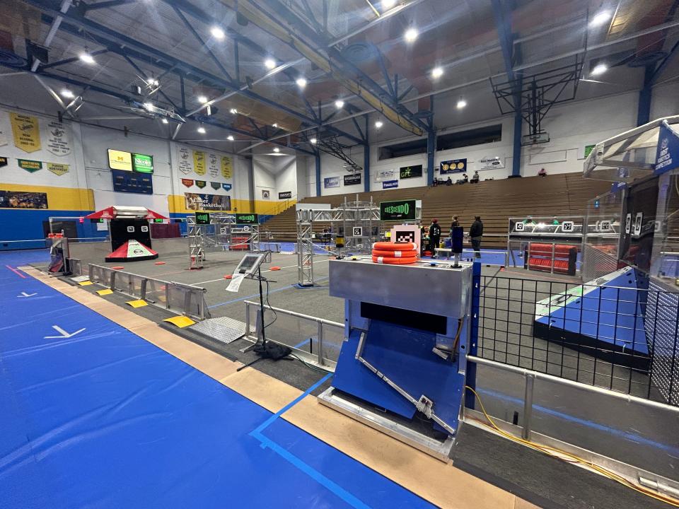 Robotics teams from various high schools prepare their machines to use in the competition area before matches begin during the FIRST Robotics competition at LSSU on March 14, 2024.
