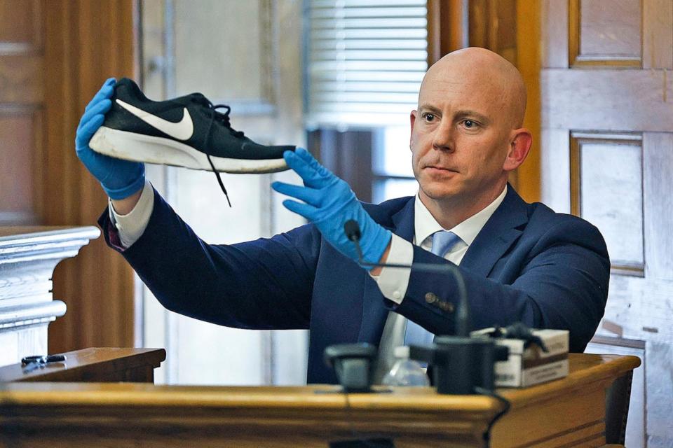 PHOTO: Massachusetts State Police Detective Lt. Brian Tully holds up a piece of evidence on the witness stand in Karen Read's murder trial, June 12, 2024, in Norfolk Super Court in Dedham, Mass. (Greg Derr/AP)