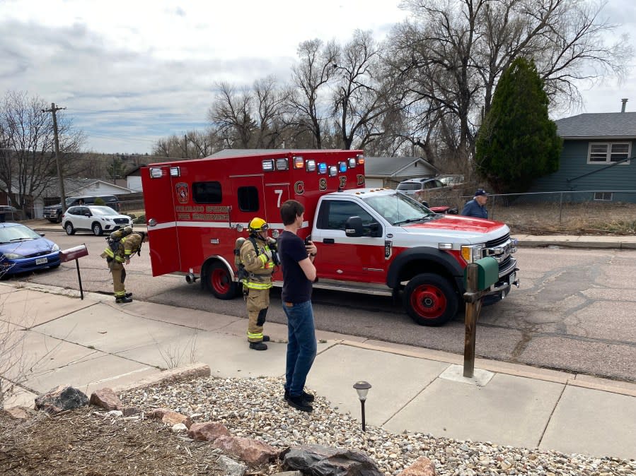 A firefighter near a fire vehicle