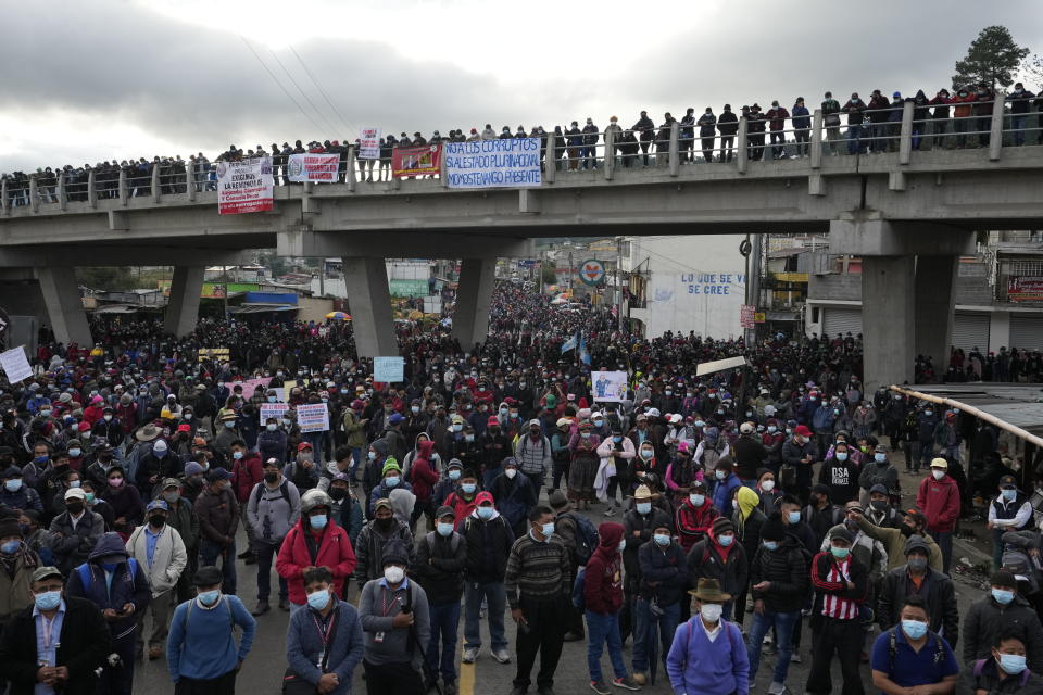 Protesters block the Inter American Highway in Totonicapan, Guatemala, after Indigenous leaders here called for a nationwide strike to pressure Guatemalan President Alejandro Giammattei to resign, Thursday, July 29, 2021. The protest comes in response to the firing of Special Prosecutor Against Impunity Juan Francisco Sandoval by Attorney General Consuelo Porras. (AP Photo/Moises Castillo)