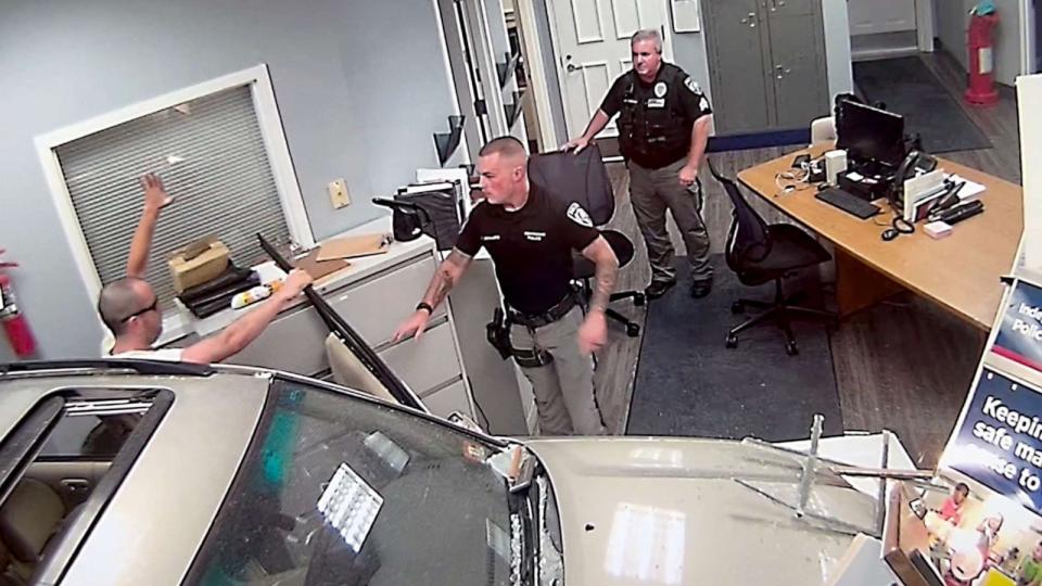 PHOTO: Surveillance image shows John Hargreaves being taken into custody after police said he deliberately drove his SUV into a home and the lobby of the Independence Township, New Jersey, Police Station on Sept. 20, 2023. (Independence Township Police Department)