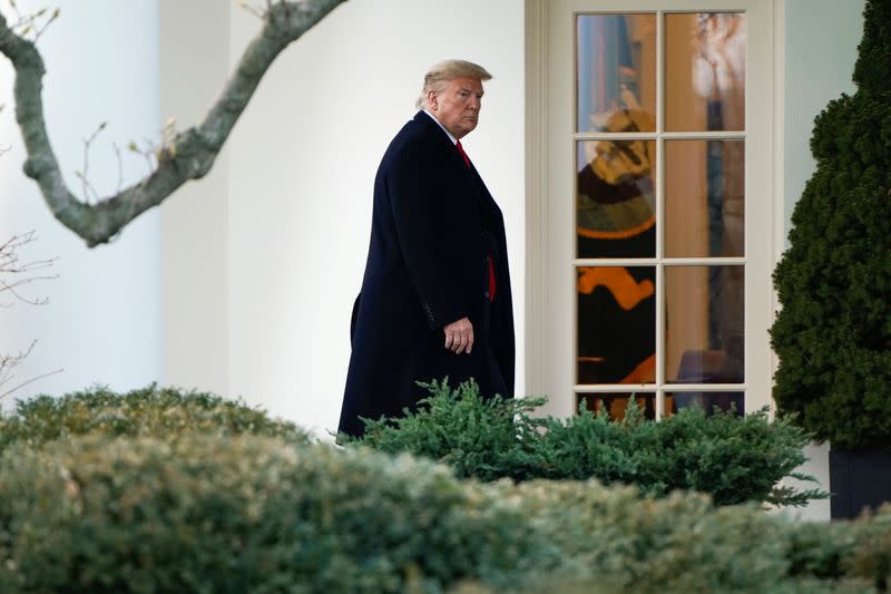 FILE PHOTO: U.S. President Donald Trump walks to the Oval Office in Washington