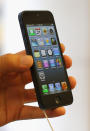 SYDNEY, AUSTRALIA - SEPTEMBER 21: A customer holds the iPhone 5 smartphone at the Apple flagship store on George street on September 21, 2012 in Sydney, Australia. Australian Apple stores are the first in the world to receive and sell the new iPhone 5 handsets. (Photo by Cameron Spencer/Getty Images)