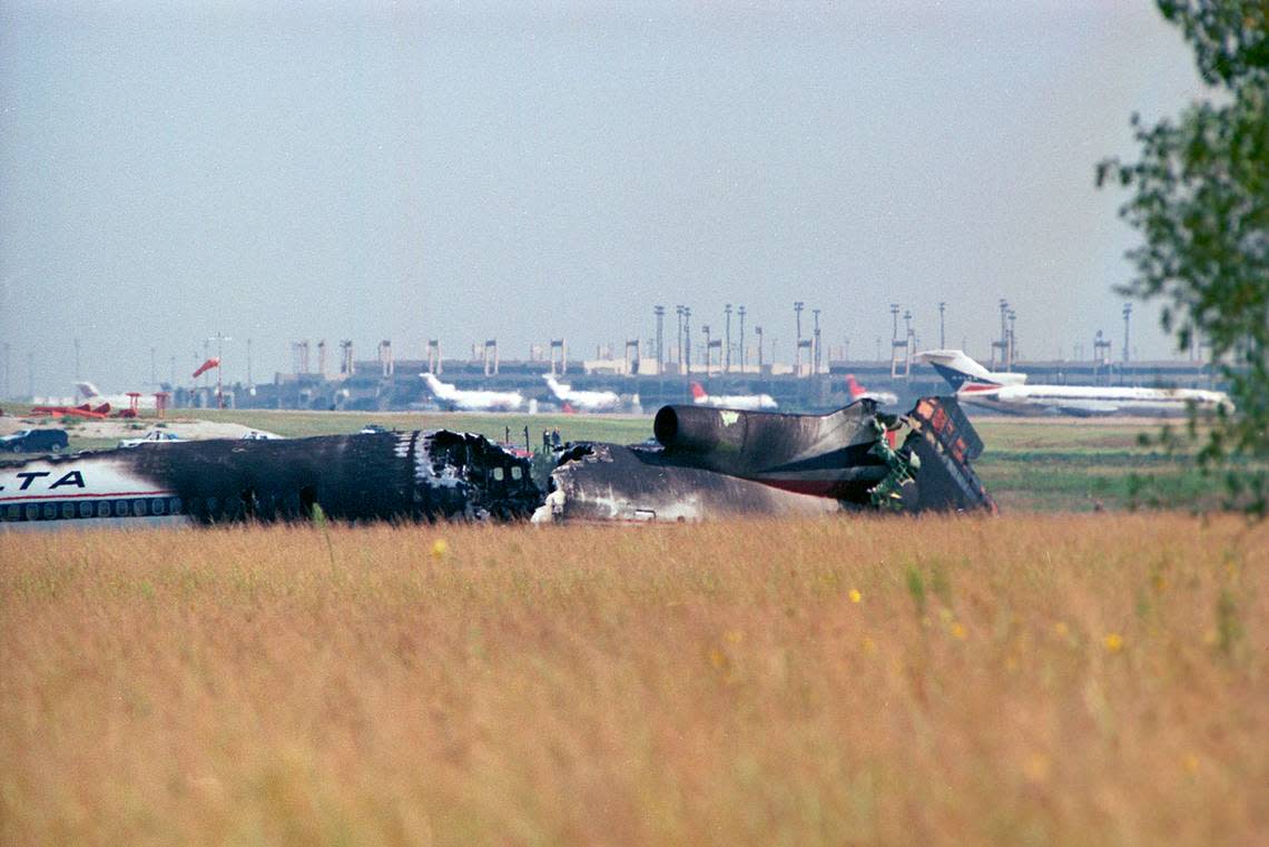 Aug. 31, 1988: The wreckage of Delta 1141 at Dallas-Fort Worth International Airport. A Boeing 727 with Delta livery similar to the one that crashed is seen in the distance to the right.